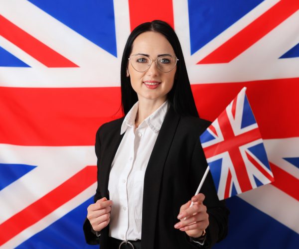 Portrait of English teacher against UK flag